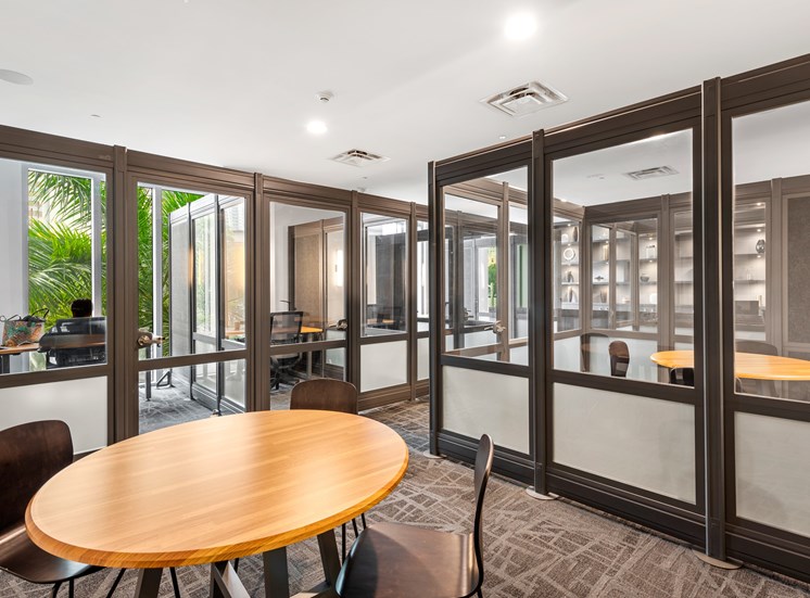 A conference room with a table and chairs.